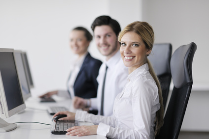 Happy workers at their computers